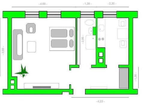 a plan of a building with green at Ferienwohnung CityFlair _ 32290 in Rostock