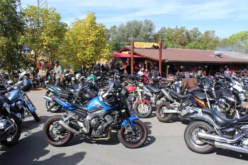 a large group of motorcycles parked in a parking lot at Zündstoff-City Western-Motel in Hemfurth-Edersee