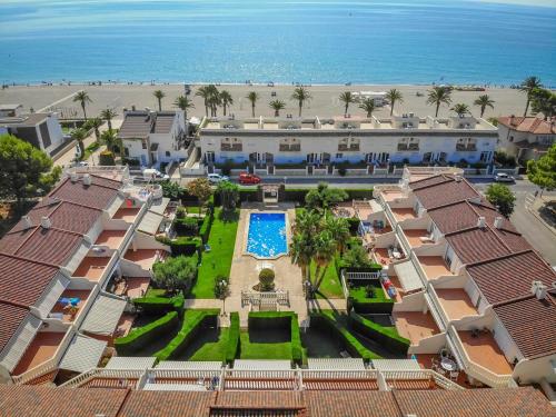 an aerial view of a resort and the beach at ARENDA Cristal 4 Pino Alto Holiday Home in Miami Platja