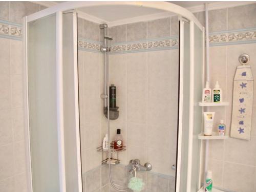 a shower with a glass door in a bathroom at Elaia Sitia Center Sea View Apartment in Sitia