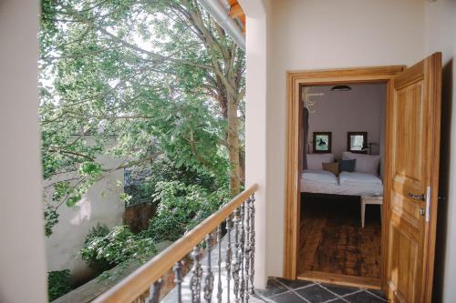 a balcony with a door leading to a bedroom at Miss Sophie's Olomouc - Boutique Hotel in Olomouc