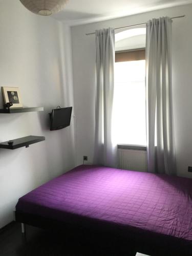 Posteľ alebo postele v izbe v ubytovaní Apartament Opera