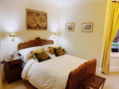 a bedroom with a large bed and a window at Little Redlands B&B in Lincoln