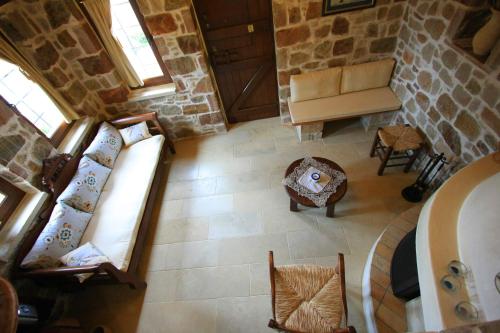 an overhead view of a living room with a couch at Lithos Traditional Guest Houses in Xerokampos
