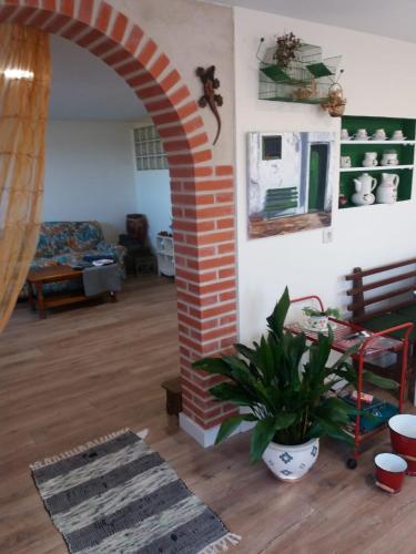 an archway in a living room with a plant at El Balcón de la Mata in Mata de Quintanar