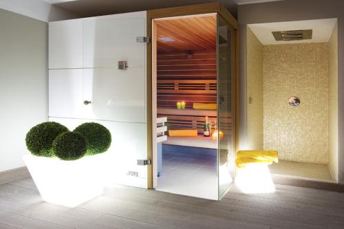 a room with a glass door leading to a bedroom at Sala Comacina Residence Apartment 5 - Sleeps up to 10 by Italian Apartments in Sala Comacina