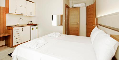 Katil atau katil-katil dalam bilik di Kavalalı Suites