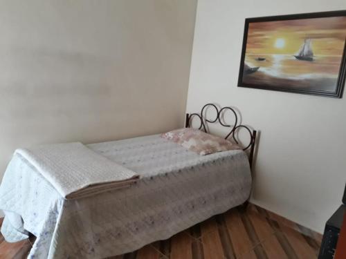 Cama ou camas em um quarto em Hostel Colonial hospedagem domiciliar