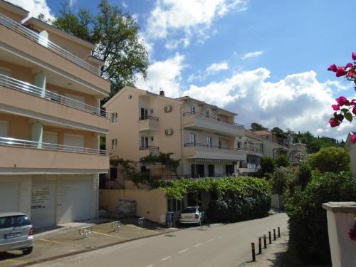 a row of apartment buildings on a city street at Apartment Tara in Herceg-Novi