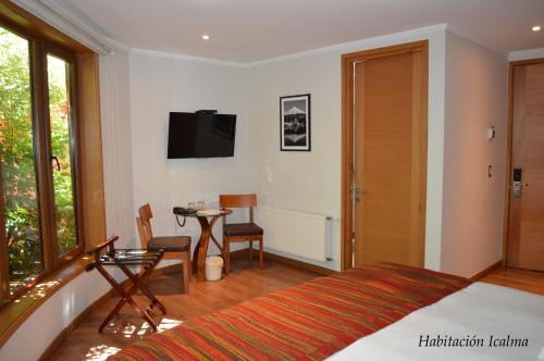 TV a/nebo společenská místnost v ubytování Cocurantu Hotel Boutique