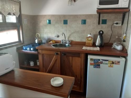 Küche/Küchenzeile in der Unterkunft Cabañas del Uru