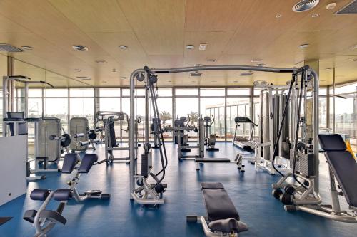 a gym with rows of treadmills and machines at Barceló Fuerteventura Mar in Caleta De Fuste