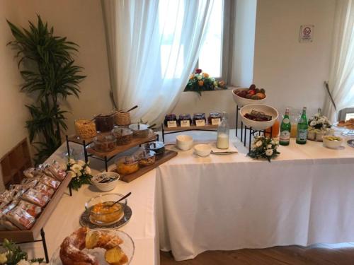 a table with a buffet of food on it at Fattoria L'Olmetto in Pisa