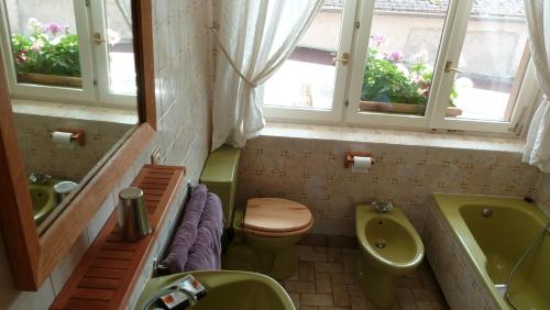 Koupelna v ubytování Chambres d'hôtes L'Ecrin des Saveurs