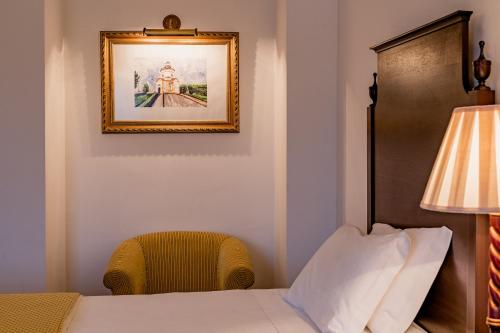 Säng eller sängar i ett rum på Casa Amarela TH & National Monument