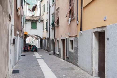 an alley between two buildings in a city at Residenza Picalof in Nago-Torbole