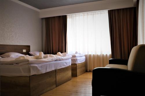Postel nebo postele na pokoji v ubytování Ketino's Home