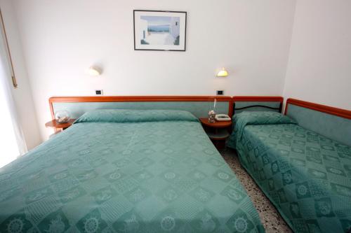 Cama o camas de una habitación en Hotel Vannini
