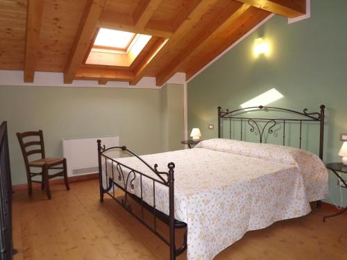 Rúm í herbergi á Agriturismo Cascina Rossano