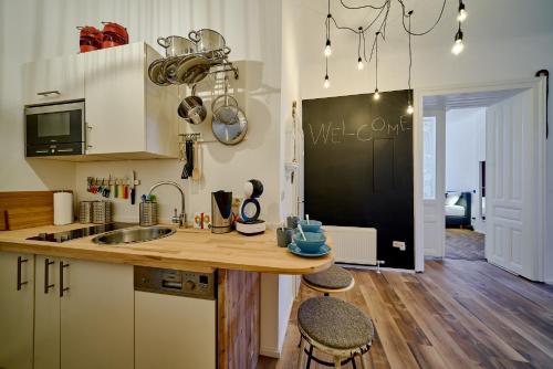 a kitchen with a sink and a counter top at Leuhusen Collection Vienna, Wien in Vienna