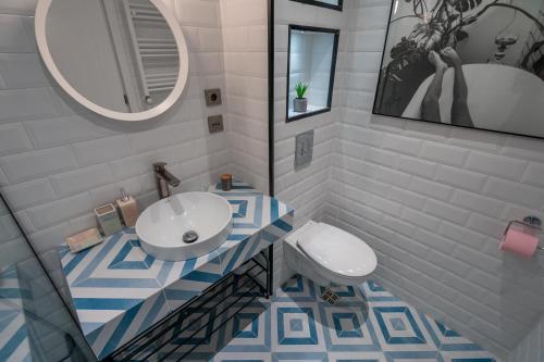 a bathroom with a sink and a toilet at New Gudauri-Loft II-Near Gondola in Gudauri