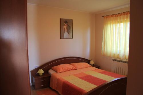 מיטה או מיטות בחדר ב-Apartments Jasna