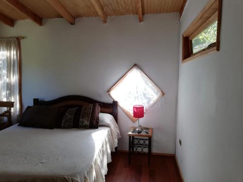 Cama o camas de una habitación en Cabañas Kalfucura