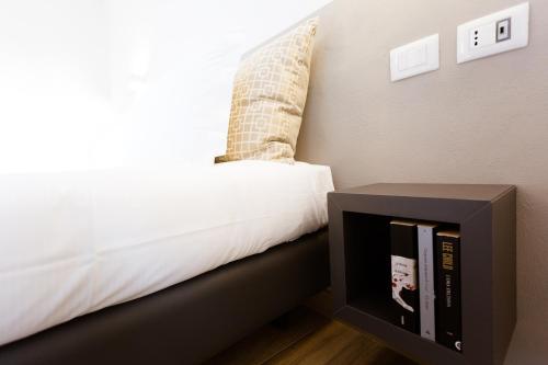 Ένα ή περισσότερα κρεβάτια σε δωμάτιο στο Sarzana's Rooms