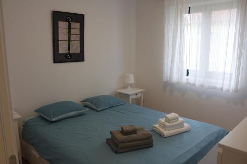 Łóżko lub łóżka w pokoju w obiekcie Divine Dalmatia Apartments 2