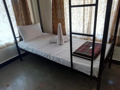 Katil atau katil-katil dalam bilik di Riverside Inn