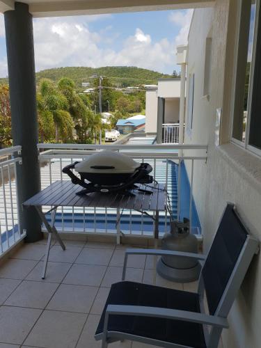 a grill sitting on a table on a balcony at Blue horizon in Yeppoon
