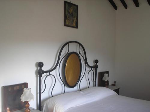 a bedroom with a bed with a mirror on it at podere San Giuseppe in Cetona