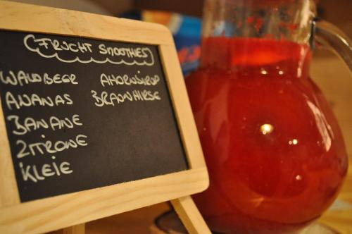 a chalkboard sign next to a jar of ketchup at Boutique Pension Erlacher - Adults Only in Villandro