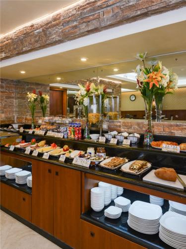 a buffet line with many different types of food at Mirita Hotel ,10th Of Ramadan in Madinat Al Ashir min Ramadan