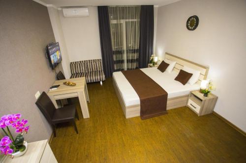 Кровать или кровати в номере Lux Apartment
