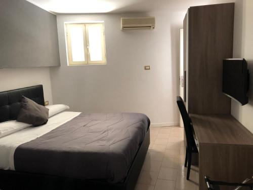 Cama o camas de una habitación en Hotel Nettuno
