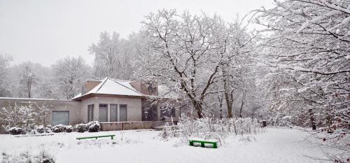 a house covered in snow in front at Marcel de Gand Business & Travel in Ghent