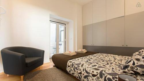 A bed or beds in a room at Alfama Charm Apartment