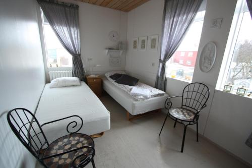 Ein Bett oder Betten in einem Zimmer der Unterkunft Dalvík Hostel Gimli