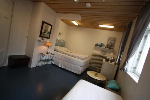Postel nebo postele na pokoji v ubytování Dalvík Hostel Gimli