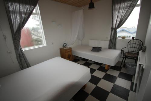 Ein Bett oder Betten in einem Zimmer der Unterkunft Dalvík Hostel Gimli