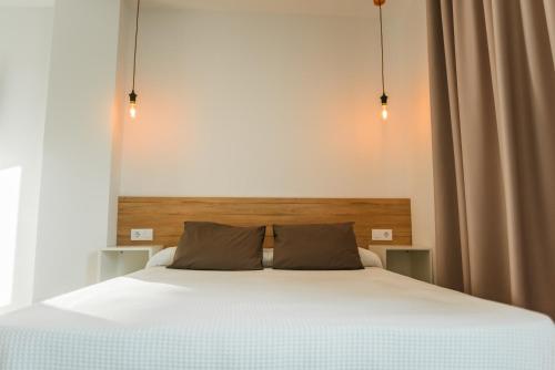 Cama o camas de una habitación en Apartamentos ZHR