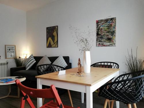 a living room with a table and chairs and a couch at Apartments 18 in Velingrad