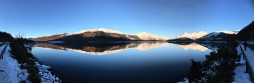 a view of a lake with snow covered mountains at Outlander Glencoe at Creag an-t Sionnaich Glencoe Ballachulish Highlands Near Fort William in Glencoe