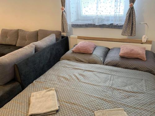 Postel nebo postele na pokoji v ubytování Apartmán Filipovice s letní terasou