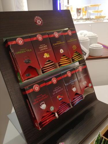 a display box filled with different types of ties at Hotel Vittoria in Genova