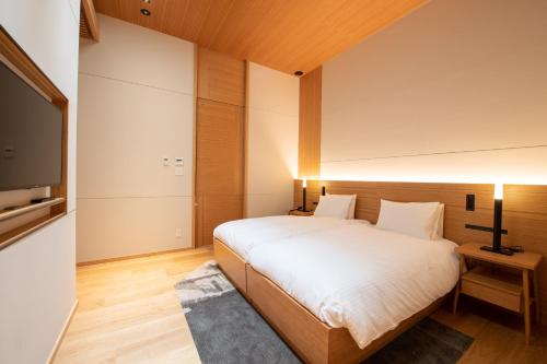 Ein Bett oder Betten in einem Zimmer der Unterkunft Skye Niseko