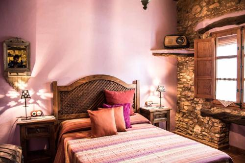 Postel nebo postele na pokoji v ubytování La Mallada