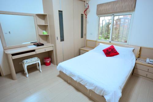 Postel nebo postele na pokoji v ubytování Jia Feng Vacation Homestay