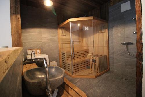 a bathroom with a sink and a shower at Alpengasthof Krische in Murau